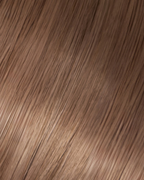A swatch of light ash brown hair texture, showcasing the softness and shine of the hair extension.