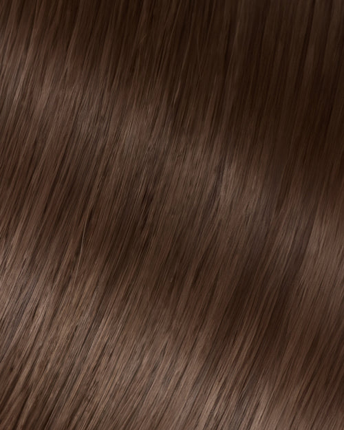 A swatch of brown hair texture, showcasing the strands of a hair extension.