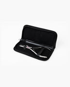 A  Deluxe Hair Extensions tool; a black case containing a Priscilla Valles keratin bond extension remover tool.
