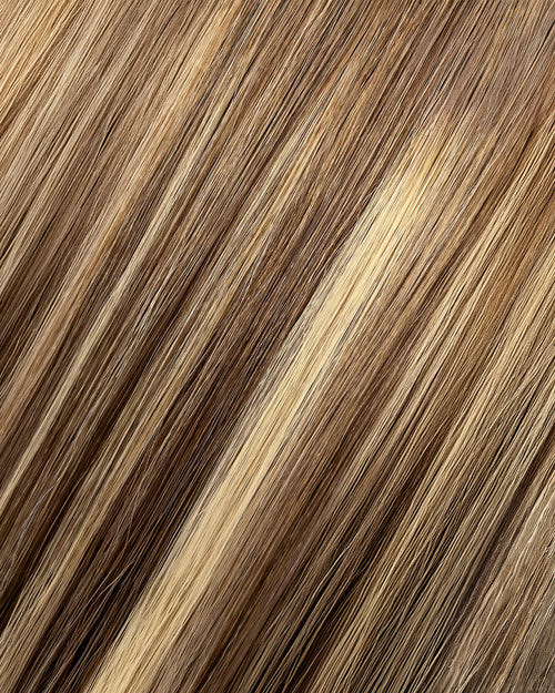 A swatch of long, blonde hair featuring a smoky beige balayage hair extension.