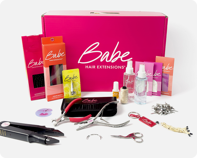 Babe Hair Extensions kit with tools, sprays, clips, and accessories for salon hair extension application and care.